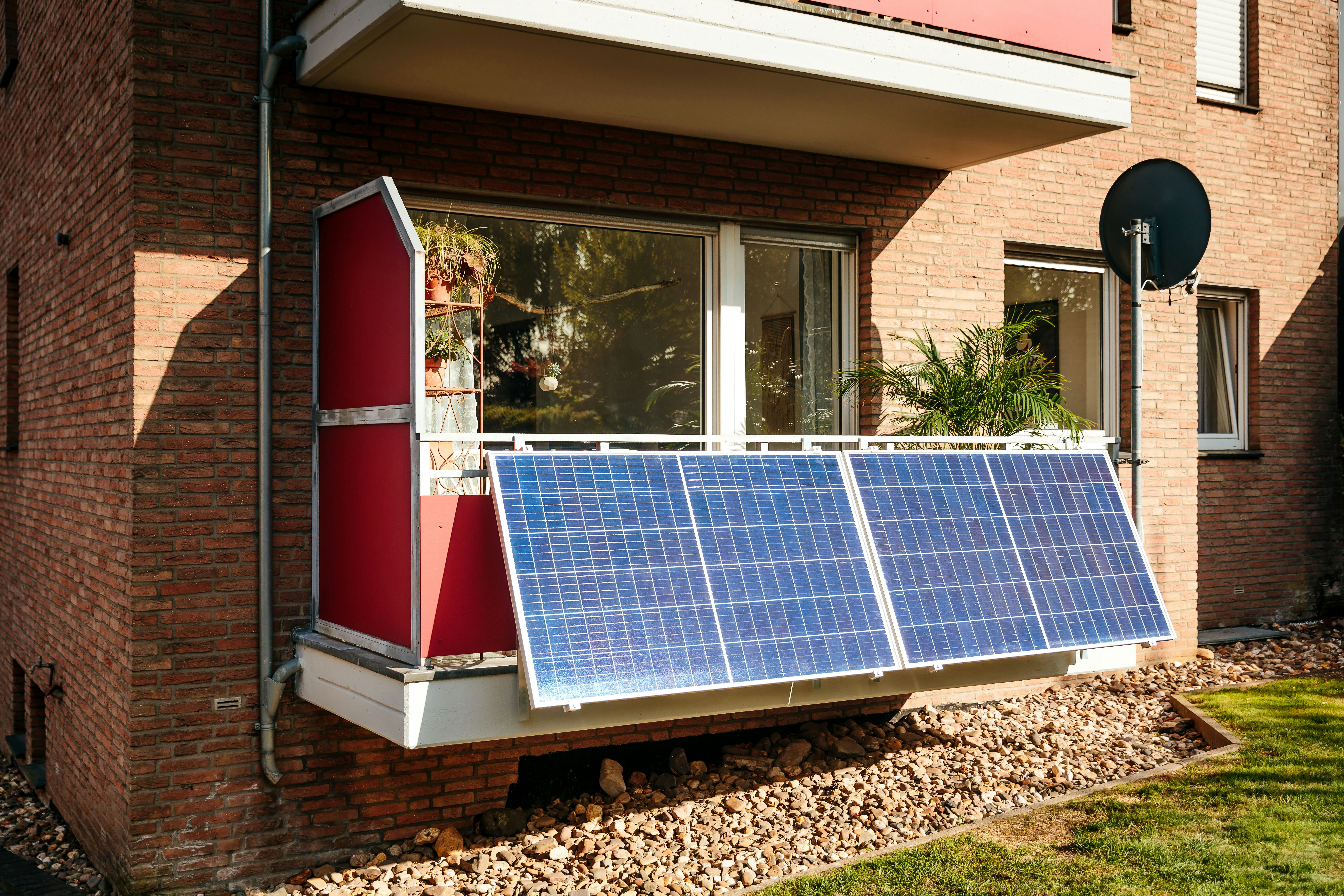 Technician installing a balcony solar panel bracket